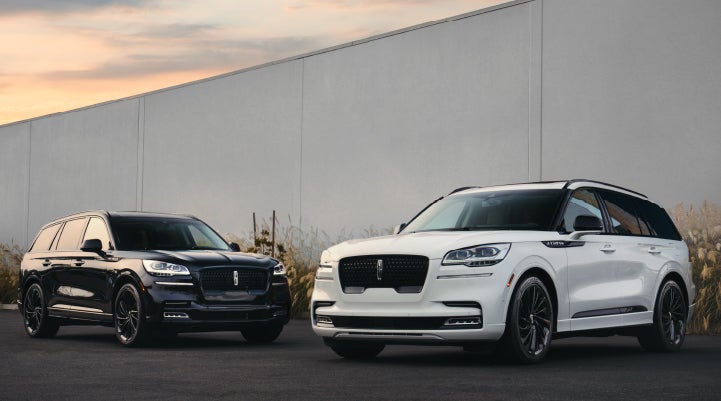 Two Lincoln Aviator® SUVs are shown with the available Jet Appearance Package | Sentry Lincoln in Medford MA