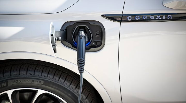An electric charger is shown plugged into the charging port of a Lincoln Corsair® Grand Touring
model. | Sentry Lincoln in Medford MA