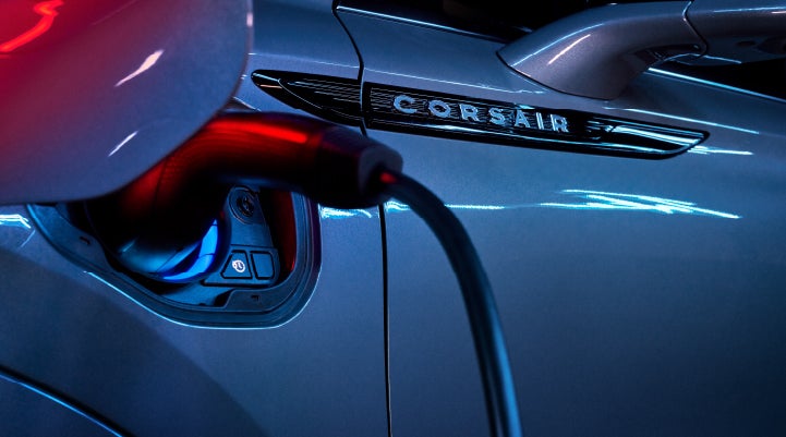 A charger plugged into the charging port of a 2024 Lincoln Corsair® Plug-in Hybrid model. | Sentry Lincoln in Medford MA
